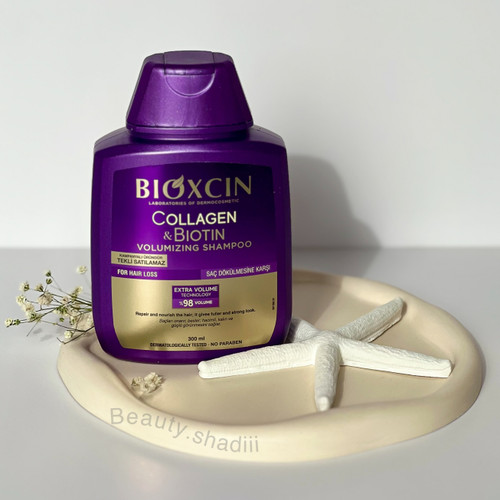 شامپو حجم دهنده و ضد ریزش مو بیوکسین مدل کلاژن و بیوتین حجم 300 میلی لیتر